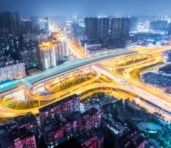 A city with many roads and buildings at night.